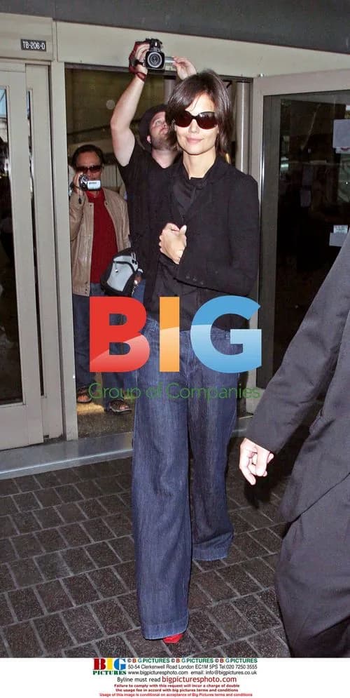 Katie Holmes Arrives at LAX in Red Heels