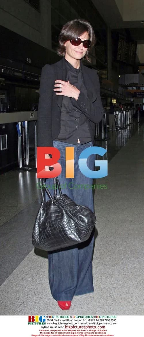 Katie Holmes Arrives at LAX in Red Heels