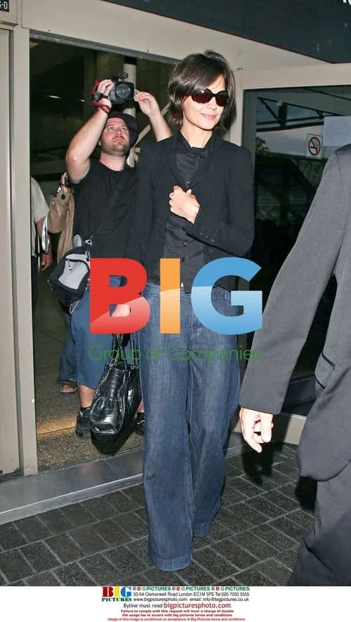 Katie Holmes Arrives at LAX in Red Heels