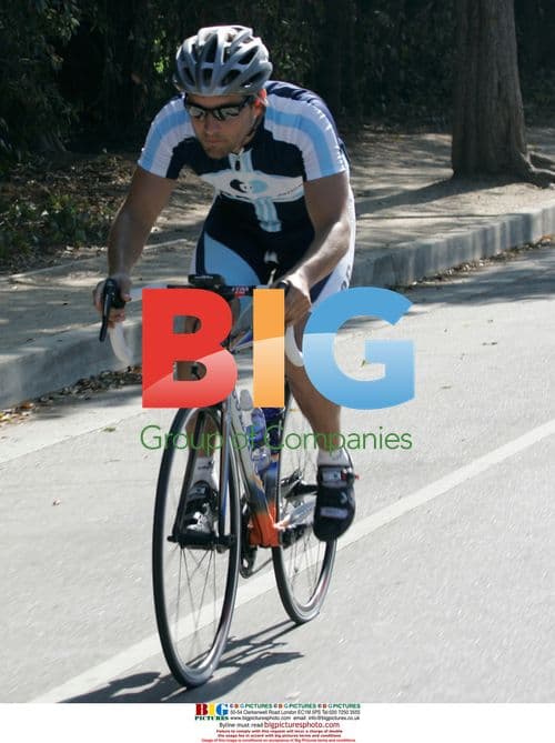 Tobey Maguire riding bike in Brentwood