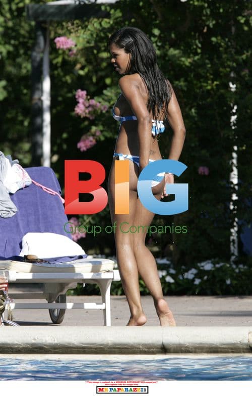 Charley Uchea Relaxing by Pool with Sister