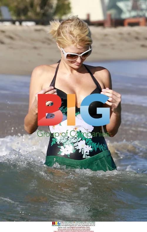 Paris Hilton and Adrian Grenier Frolic at Malibu Beach