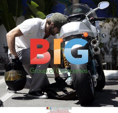 Ryan Reynolds Leaves Fred Segal on Motorcycle