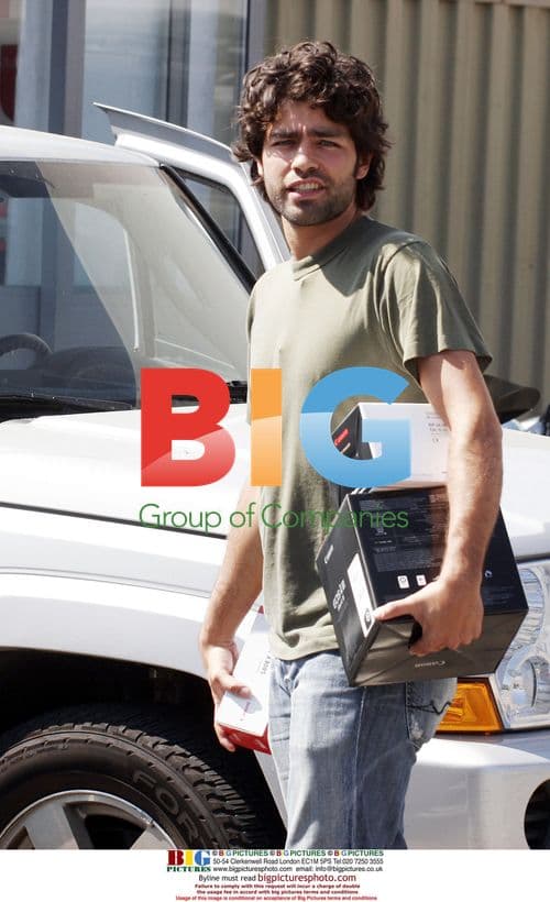 Adrian Grenier Shops at Camera Store