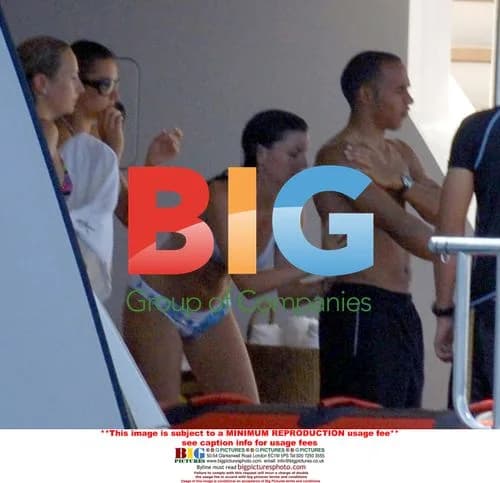 Lewis Hamilton gets rubbed down by friend