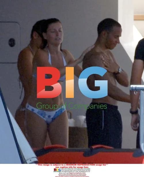 Lewis Hamilton gets sun protection