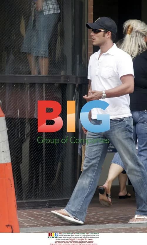 Paul Sculfor leaving store with friend