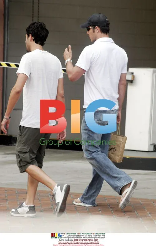Paul Sculfor Leaving Store with Friend