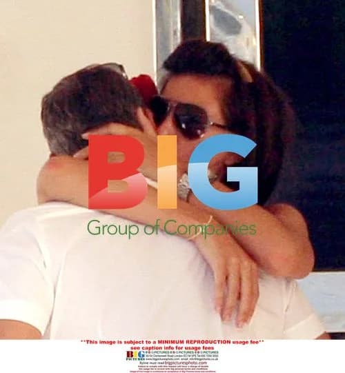 George Clooney and Brunette Woman on Yacht