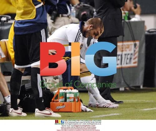 David Beckham Sits on Bench During Match