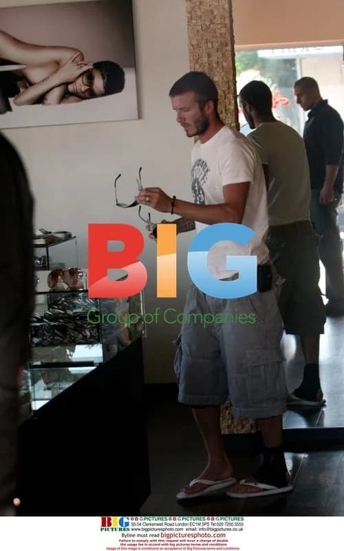 David Beckham shops for sunglasses with son Brooklyn