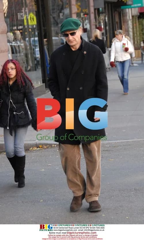 Liam Neeson walks on Upper West Side