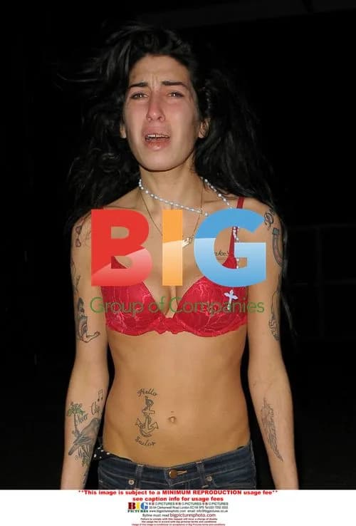 Amy Winehouse Spotted Out in Bra and Jeans