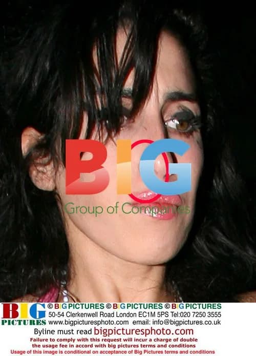 Amy Winehouse in Soho with powder on nose