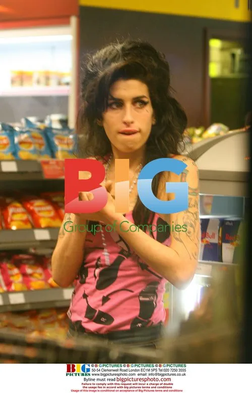 Amy Winehouse in Soho with powder on nose