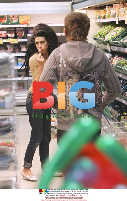 Amy Winehouse Leaves London Home with Friend