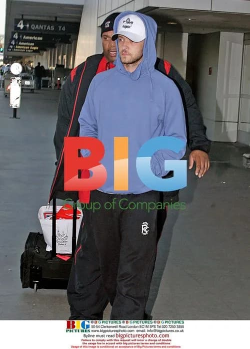 Justin Timberlake Arrives at LAX with Bodyguard