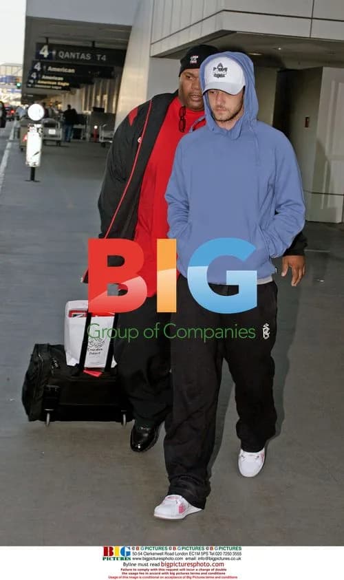 Justin Timberlake Arrives at LAX with Bodyguard
