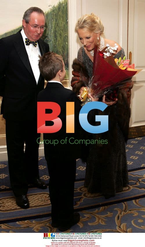 Steven Tomlinson Presents Flowers to Princess Michael