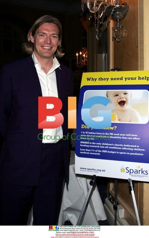 Steven Tomlinson presents flowers to Princess Michael