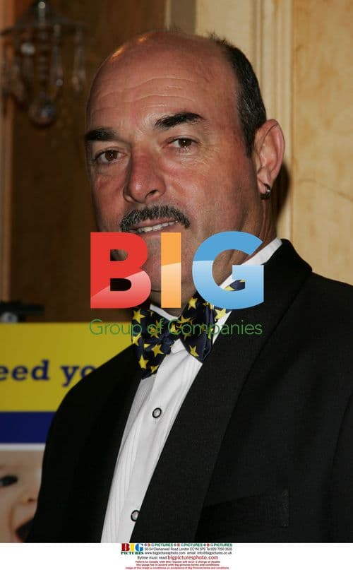 Steven Tomlinson presents flowers to Princess Michael