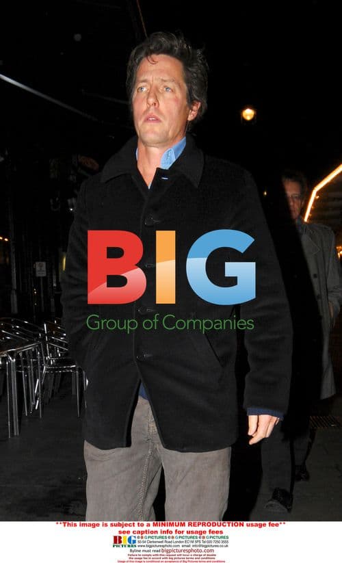 Hugh Grant Leaves Restaurant with Friends