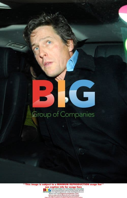 Hugh Grant Leaves Restaurant with Friends