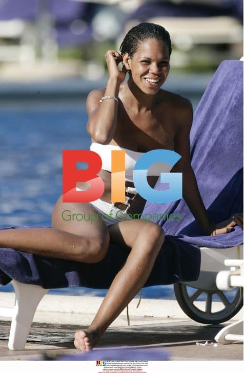 Charley Uchea relaxes poolside in the Caribbean