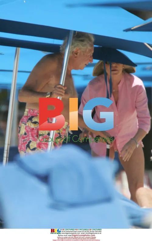 Michael Winner and Partner on Beach in Barbados