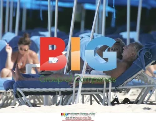 Michael Winner on beach in Barbados