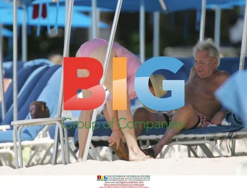 Michael Winner and partner on Barbados beach