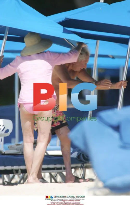 Michael Winner and partner on Barbados beach
