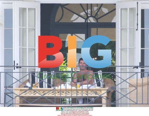 Simon Cowell on Balcony in Barbados