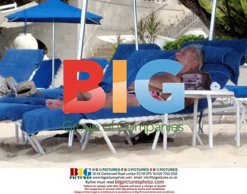 Michael Winner dozing in Caribbean