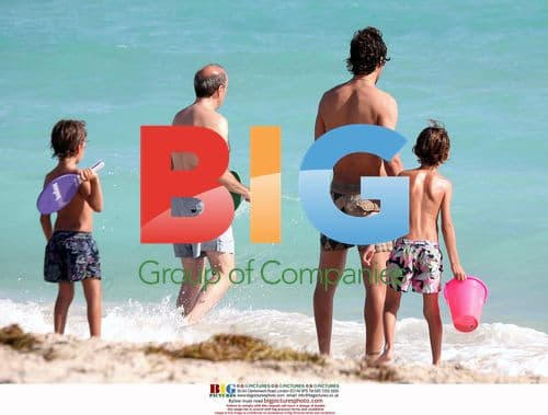 Raul Gonzales Blanco with sons at Ritz-Carlton beach