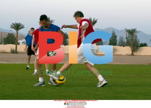 Tony Blair and son play football on vacation