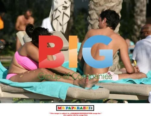 Jade Goody and Jack Tweed in pink swimwear