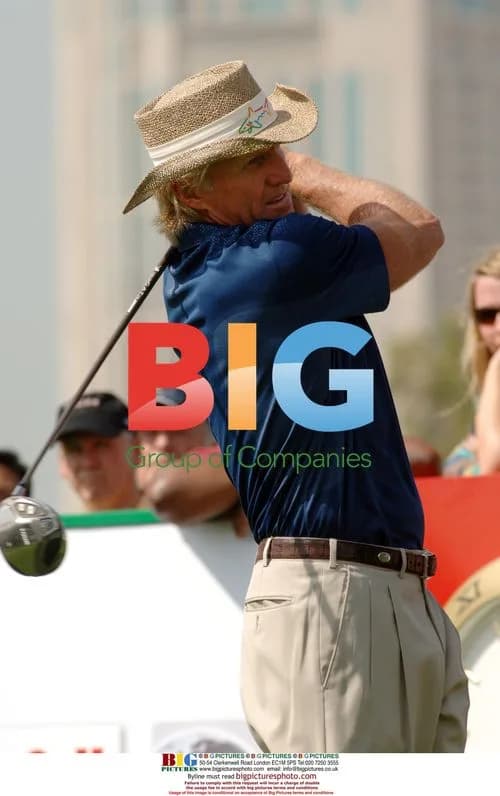 Greg Norman teeing off at Dubai Desert Classic