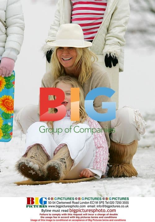 Meg Matthews and Daughter Sledding