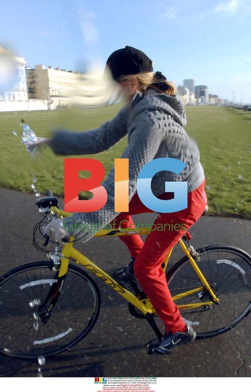 Heather Mills and trainer ride bikes