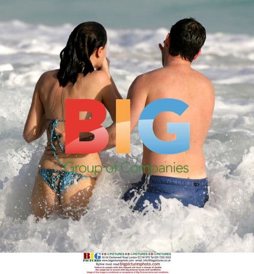 Linzi Stoppard Frolics in Caribbean with Husband