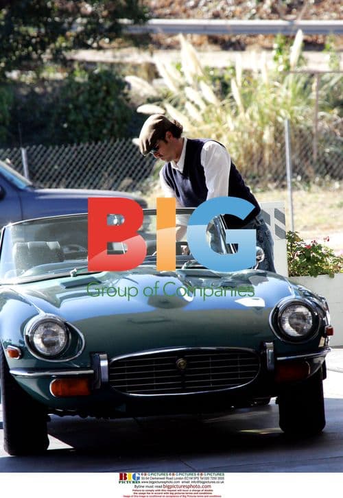 Patrick Dempsey pumping gas in Jaguar