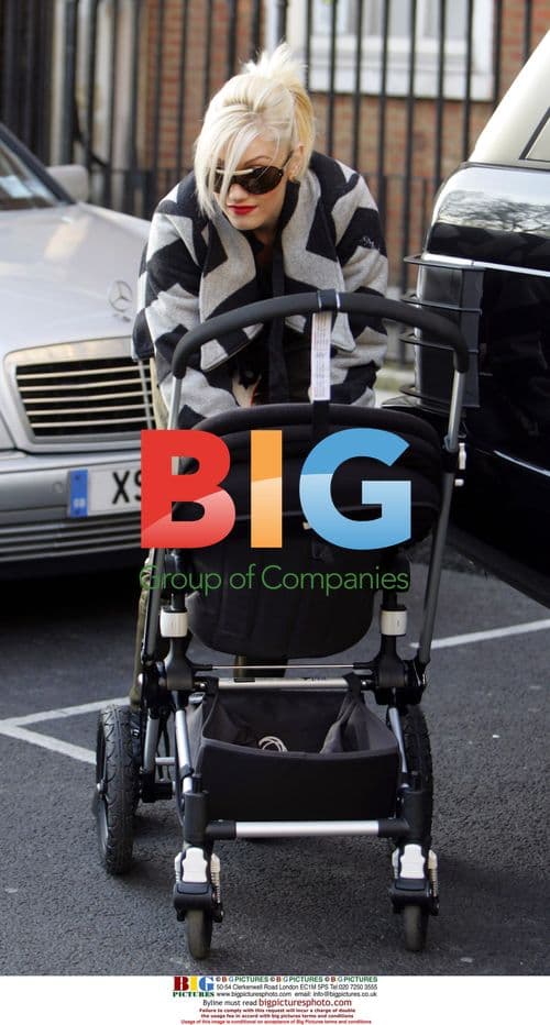Gwen Stefani Helps Husband Gavin With Pushchair