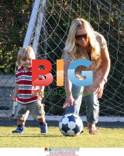 Declan Donnelly plays soccer with Robbie Williams