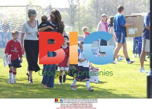 Victoria Beckham with sons leaving football school