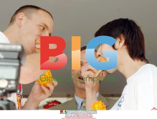 Rival hotdog eaters pose before contest