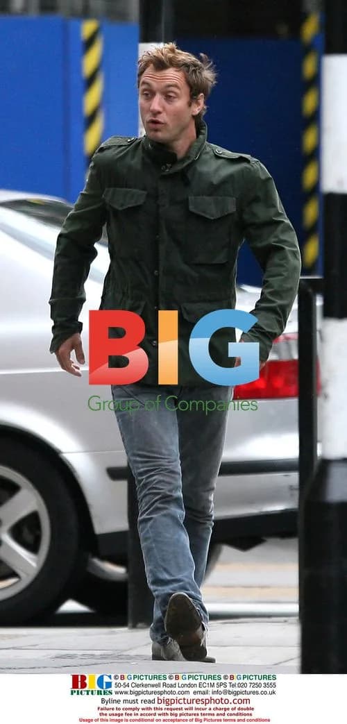 Jude Law Chats with Pals in London