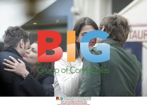 Jude Law Chats and Kisses Friends in London