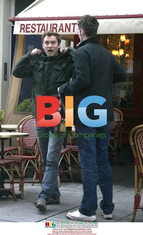 Jude Law chatting with friends in London