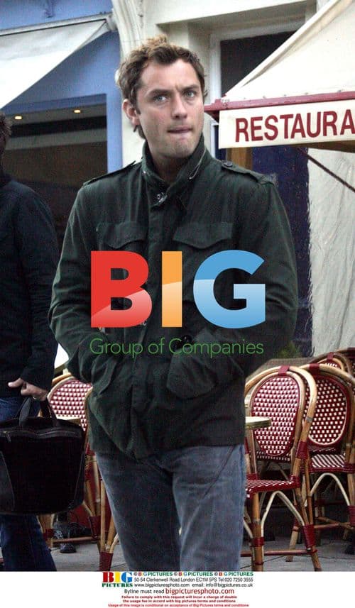 Jude Law Chats with Friends in London